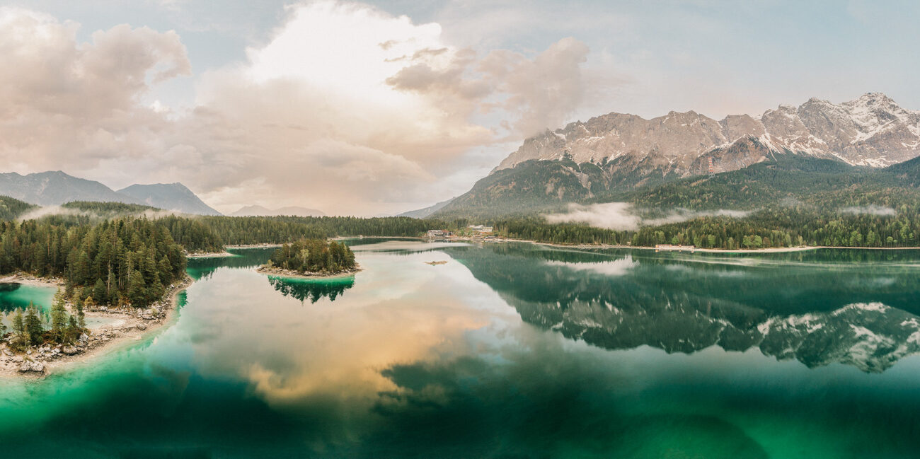 Lake Eibsee mountain elopement sunset with Germany's highest mountain Zugspitze.Elopement photographer and videographer in the Alps